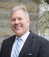 Headshot of author Brian Baker